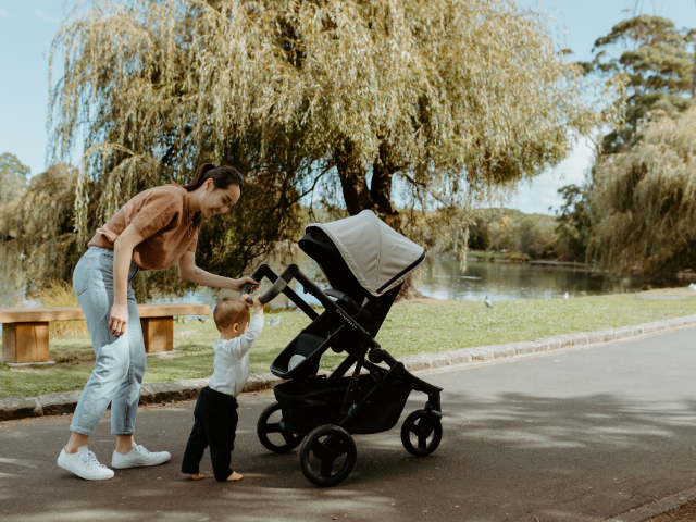 Pram pushchair with mother and baby